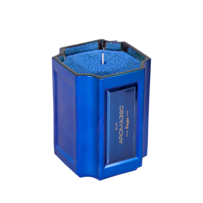 The Bougie Sand Wax Set features a 40oz scented sand wax, 30 candle wicks, and a stunning 33oz recyclable metallic vessel. Available in Blue, Red, Black, Green, and Purple scents, this eco-friendly, refillable candle set offers a sustainable and opulent ambiance.
